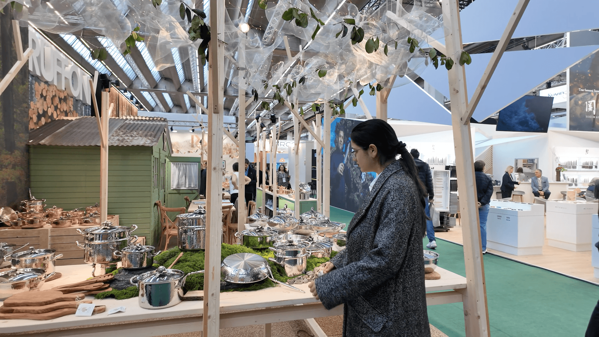 Woman looking at trade fair exhibition